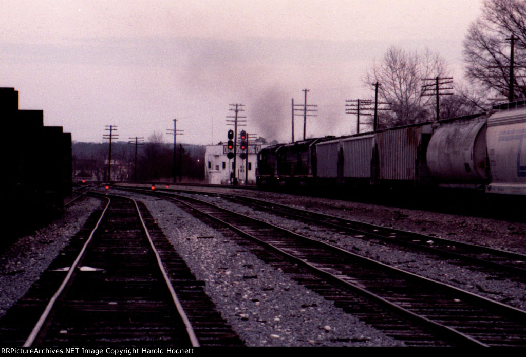 s getting dark as a northbound train heads for the signals at the north end of the yard